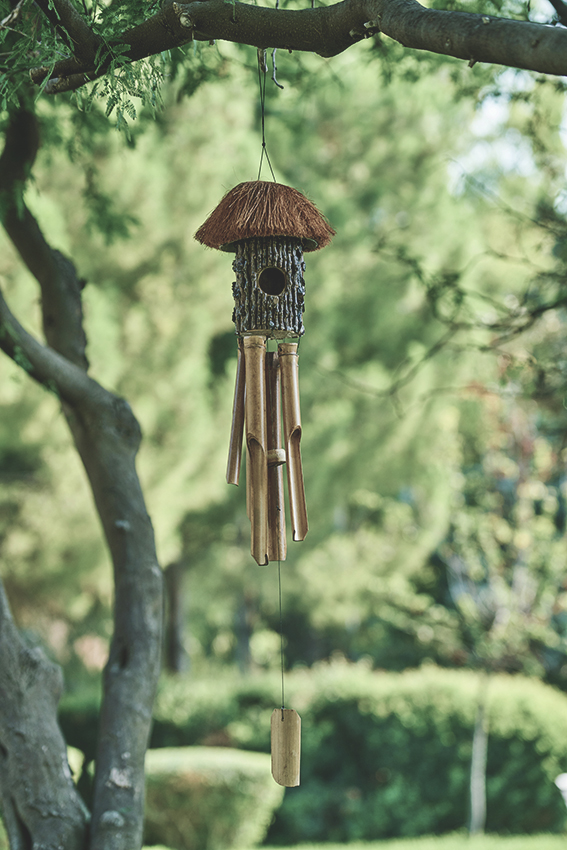 Add Personal Touches to Your Relaxation Station with windchimes, outdoor rugs and throw blankets