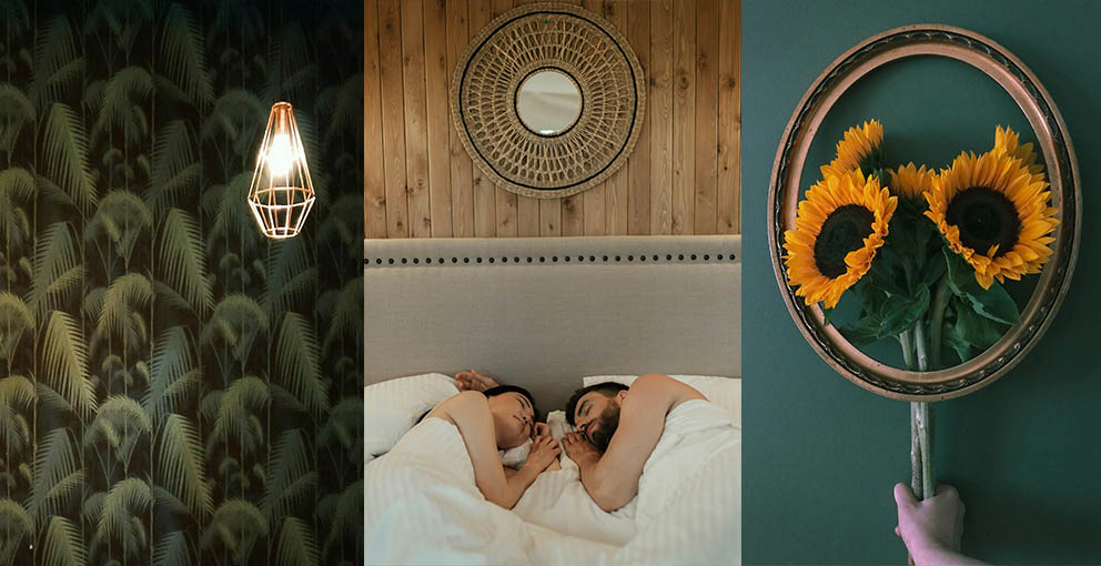 Boho bedroom wall decor with rattan mirror, tropical leaf wallpaper and unique whimsical chic art