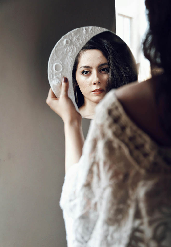 Boho moon-shaped mirror for a witchy aesthetic