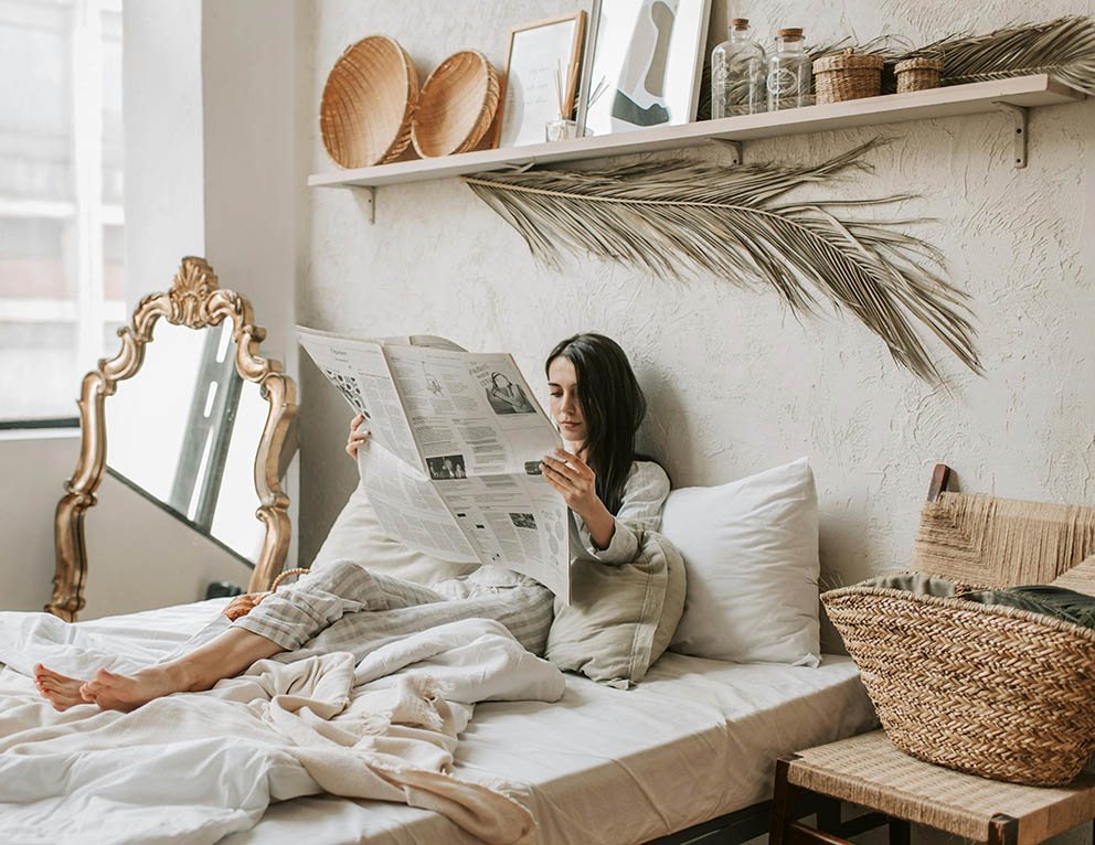Golden boho mirror and boho decor items like rattan baskets
